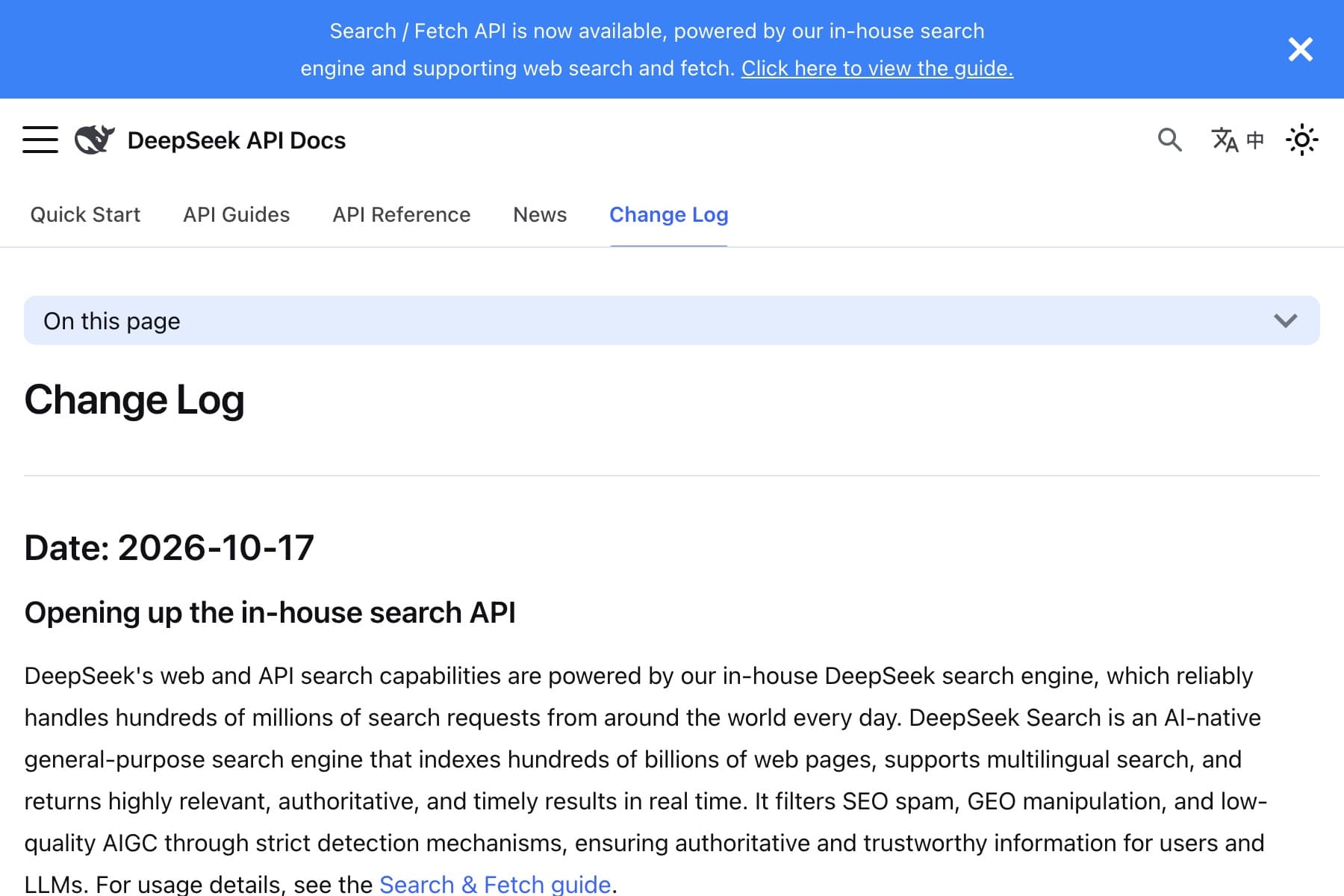 Captura de una página web de fondo blanco. Arriba, una franja azul ocupa todo el ancho con el aviso en inglés «Search / Fetch API is now available, powered by our in-house search engine and supporting web search and fetch.» y el enlace subrayado «Click here to view the guide.»; a su derecha, una equis blanca para cerrar. Debajo, a la izquierda, un icono de menú de tres rayas, un dibujo de ballena en negro y el rótulo «DeepSeek API Docs»; a la derecha, una lupa, un icono de traducción con el carácter «中» y un sol. Sigue una barra con cinco pestañas —«Quick Start», «API Guides», «API Reference», «News» y «Change Log»—, la última en azul y subrayada. Después, un recuadro azul claro con el texto «On this page» y una flecha hacia abajo, el titular «Change Log» en letra negra muy grande, una línea separadora, el encabezado «Date: 2026-10-17» y el subtítulo «Opening up the in-house search API». Cierra la captura un párrafo largo en inglés sobre el buscador propio de DeepSeek, que termina con el enlace azul «Search & Fetch guide».